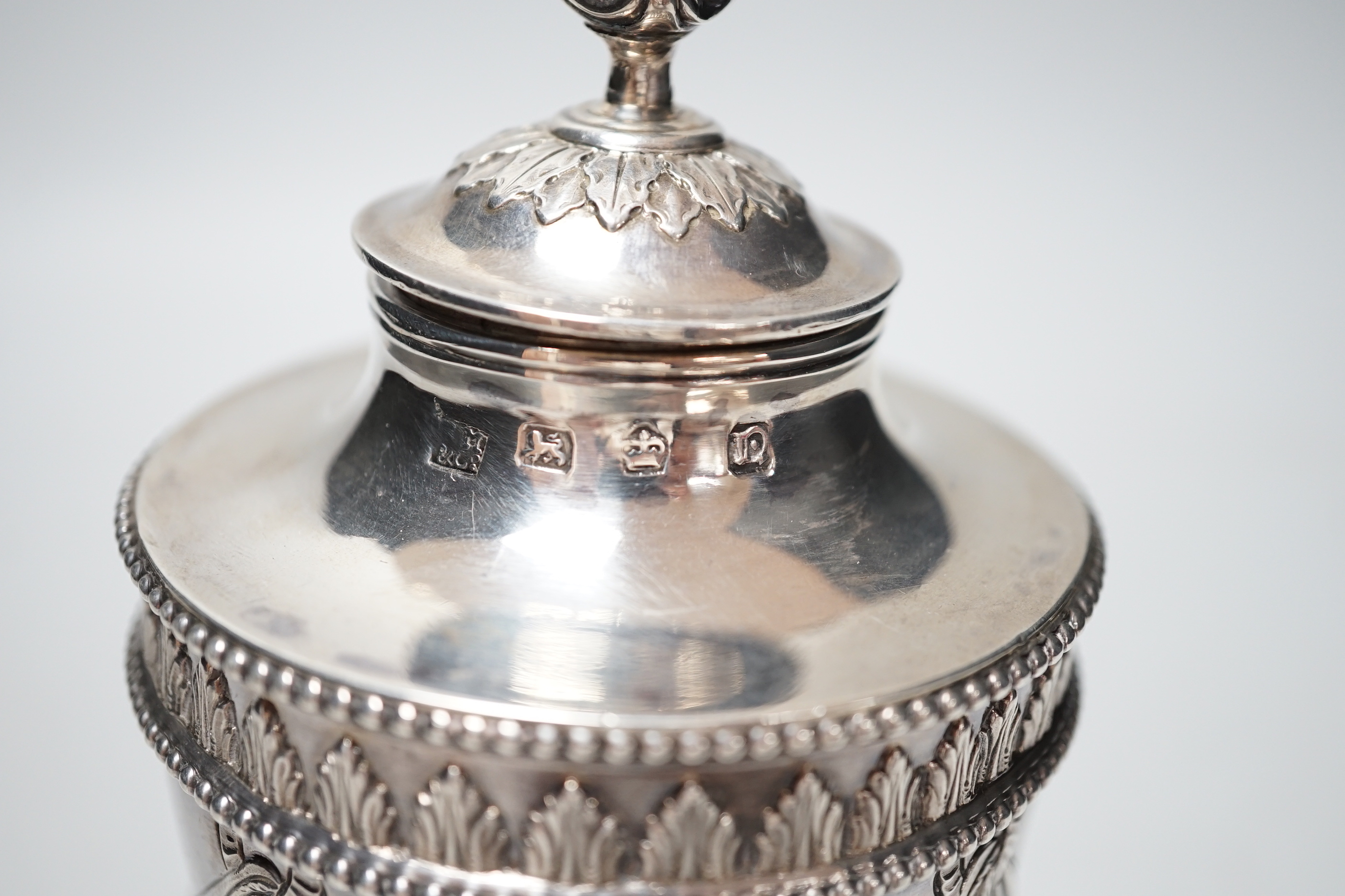 A George III silver vase and cover, with swag and fern decoration, on square base, with ball feet, Richard Morton & Co, Sheffield, 1775, 18cm, 8.7oz.